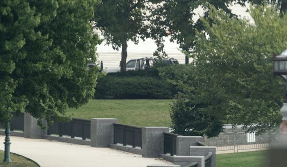 A suspicious vehicle is investigated in front of the Supreme Court, Tuesday, Oct. 5, 2021, in Washington. (AP Photo/Alex Brandon)