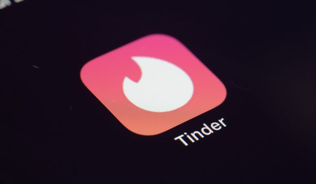 This July 28, 2020, file photo shows the icon for the Tinder dating app on a device in New York. (AP Photo/Patrick Sison, File)