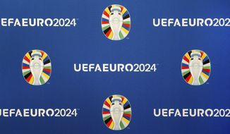 The official logo for the UEFA EURO 2024 in Germany is presented during the UEFA EURO 2024 brand launch in Berlin, Germany, Tuesday, Oct. 5, 2021. Germany will host the UEFA EURO 2024 soccer tournament. (AP Photo/Michael Sohn)