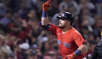 Boston Red Sox&#39;s Kyle Schwarber celebrates his solo homer in the third inning of an American League Wild Card playoff baseball game against the New York Yankees at Fenway Park, Tuesday, Oct. 5, 2021, in Boston. (AP Photo/Charles Krupa)