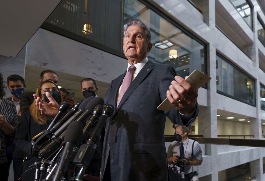 Sen. Joe Manchin, D-W.Va., a key holdout vote on President Joe Biden&#39;s domestic agenda, makes a statement to reporters about Republicans and Democrats resolving their fight over raising the debt limit, at the Capitol in Washington, Wednesday, Oct. 6, 2021. (AP Photo/J. Scott Applewhite)