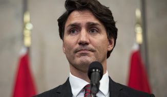 Prime Minister Justin Trudeau speaks during an announcement that Canadians Michael Spavor and Michael Kovrig have been released from detention in China, on Parliament Hill in Ottawa, on Friday, Sept. 24, 2021. (Justin Tang/The Canadian Press via AP)