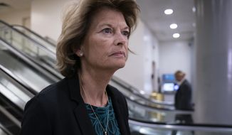 In this Jan. 8, 2020, file photo Sen. Lisa Murkowski, R-Alaska, heads to a briefing on Capitol Hill in Washington. An Alaska man faces federal charges after authorities allege he threatened to hire an assassin to kill Murkowski, according to court documents unsealed Wed., Oct. 6, 2021. (AP Photo/J. Scott Applewhite,File)