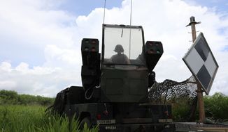 Ohio National Guard&#39;s Pfc. Trey Risner, assigned to Charlie Battery, 1st Battalion, 174th Air Defense Artillery Regiment, prepares to operate the Avenger Air Defense System during exercise Forager 21 on July 30, 2021, Tinian, Northern Mariana Islands. The Avenger is a self-propelled surface-to-air missile system which provides mobile, short-range air defense protection for ground units. Exercise Forager 21 exercises our ability to conduct strategic deployment and Joint operational maneuver of forces into and across the Indo-Pacific theater. (Photo by Army Spc. Olivia Lauer) **FILE**