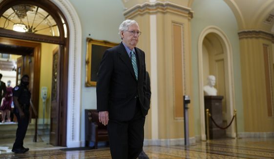 Senate Minority Leader Mitch McConnell, R-Ky., leaves the chamber after speaking, at the Capitol in Washington, Thursday, Oct. 7, 2021. Republican and Democratic senators have edged back from a perilous standoff over lifting the nation&#39;s borrowing cap and will likely extend the deadline until December. (AP Photo/J. Scott Applewhite)