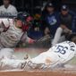 Tampa Bay Rays&#39; Randy Arozarena (56) slides past Boston Red Sox catcher Christian Vazquez, left, as he steals home during the seventh inning of Game 1 of a baseball American League Division Series, Thursday, Oct. 7, 2021, in St. Petersburg, Fla. (AP Photo/Steve Helber)
