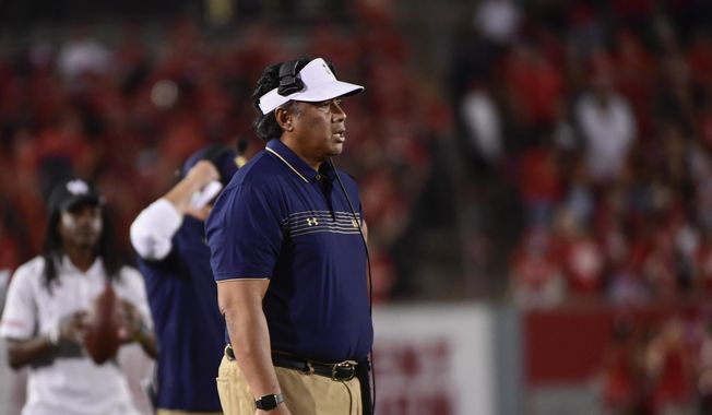 Navy head coach Ken Niumatalolo stands on the sideline during the second half of an NCAA college football game against Houston, Saturday, Sept. 25, 2021, in Houston. (AP Photo/Justin Rex) **FILE**