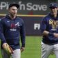Milwaukee Brewers&#39; Christian Yelich talks to Atlanta Braves&#39; Joc Pederson at a practice for the Game 1 of the NLDS baseball game Thursday, Oct. 7, 2021, in Milwaukee. The Braves plays the Milwaukee Brewers in Game 1 on Friday, Oct. 8, 2021. (AP Photo/Morry Gash) **FILE**