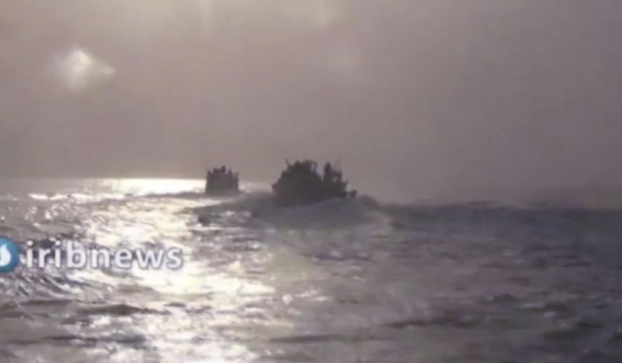 This frame grab from video aired by Islamic Republic of Iran Broadcasting, IRIB, state-run TV, on Thursday, Oct. 7, 2021, shows two vessels in the Persian Gulf. Iran’s state TV reported that speedboats belonging to the country&#39;s paramilitary Revolutionary Guard have intercepted a U.S. vessel in the Persian Gulf. A U.S. Navy spokesman said he was not aware of any such encounter at sea over the past days. (IRIB via AP)