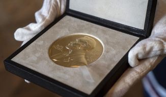 A Tuesday, Dec. 8, 2020 file photo of a Nobel Prize medal. (AP Photo/Jacquelyn Martin, File)