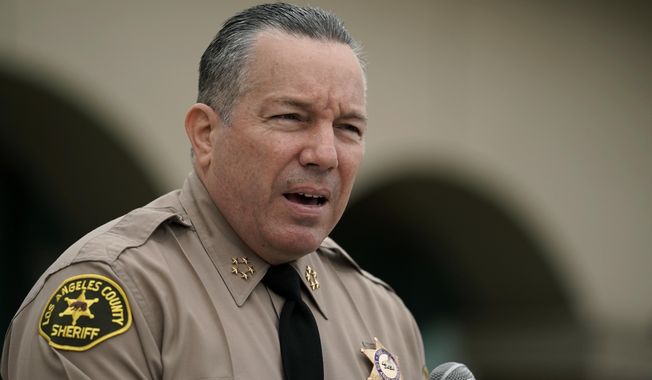 FILE - In this Sept. 10, 2020, file photo Los Angeles County Sheriff Alex Villanueva speaks at a news conference in Los Angeles. Villanueva says he will not enforce the county&#x27;s vaccine mandate in his agency. Villanueva, who oversees the largest sheriff&#x27;s department in the county with roughly 18,000 employees, said Thursday, Oct. 7, 2021, in a Facebook Live event that he does not plan to carry out the county&#x27;s mandate, under which Los Angeles County employees had to be fully vaccinated by Oct. 1, 2021. (AP Photo/Jae C. Hong,File)