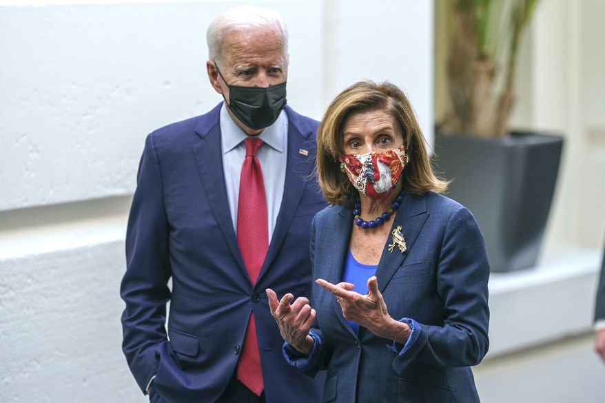 President Joe Biden and Speaker of the House Nancy Pelosi, D-Calif., talk in a basement hallway of the Capitol after meeting with House Democrats to rescue his $3.5 trillion government overhaul and salvage a related public works bill, in Washington, Friday, Oct. 1, 2021. (AP Photo/J. Scott Applewhite)