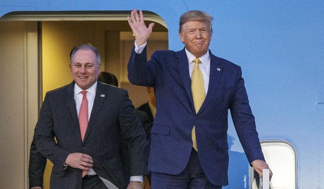 In this Friday, Oct. 11, 2019, file photo, President Donald Trump and House Minority Whip Steve Scalise, R-La., arrive in Lake Charles, La. In a television interview aired Sunday, Oct. 10, 2021, Scalise, the House’s second-ranking Republican, stood by Trump’s lie that Democrat Joe Biden won the White House because of mass voter fraud. (AP Photo/Brett Duke, File)