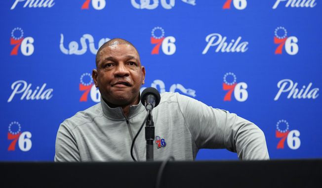 Philadelphia 76ers head coach Doc Rivers pauses while speaking to the media before a preseason NBA basketball game against the Brooklyn Nets, Monday, Oct. 11, 2021, in Philadelphia. Rivers says the franchise still wants disgruntled All-Star guard Ben Simmons to the return to the team. (AP Photo/Matt Slocum)
