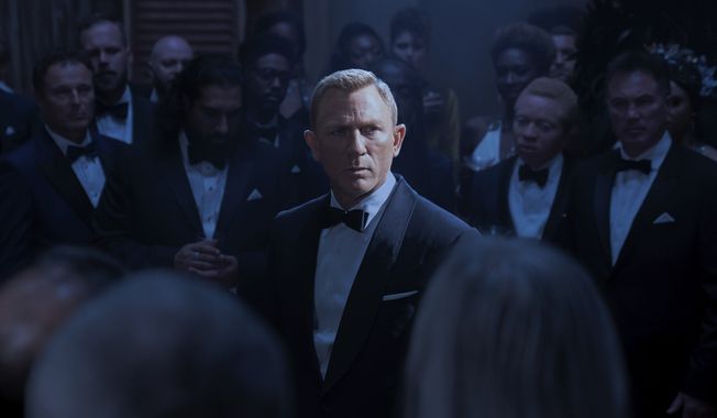 This image released by Metro Goldwyn Mayer Pictures shows Daniel Craig in a scene from &quot;No Time To Die.&quot; (Nicola Dove/Metro Goldwyn Mayer Pictures via AP)