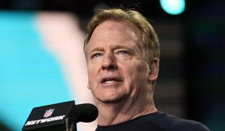 In this May 1, 2021, file photo, NFL Commissioner Roger Goodell announces the start of the fourth round of the NFL football draft in Cleveland. Jon Gruden is out as coach of the Las Vegas Raiders after emails he sent before being hired in 2018 contained racist, homophobic and misogynistic comments. A person familiar with the decision said Gruden is stepping down after The New York Times reported that Gruden frequently used misogynistic and homophobic language directed at Goodell and others in the NFL. (AP Photo/Tony Dejak, File) **FILE**