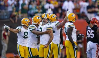 Green Bay Packers kicker Mason Crosby (2) celebrates after a winning field goal during overtime in an NFL football game against the Cincinnati Bengals in Cincinnati, Sunday, Oct. 10, 2021. The Packers defeated the Bengals 25-22 in overtime. (AP Photo/Bryan Woolston) **FILE**