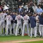 Houston Astros players celebrate beating the Chicago White Sox 10-1 in Game 4 of a baseball American League Division Series Tuesday, Oct. 12, 2021, in Chicago. (AP Photo/Charles Rex Arbogast)