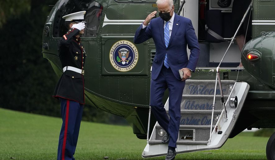President Joe Biden salutes as he steps off of Marine One on the South Lawn of the White House in Washington, Monday, Oct. 11, 2021. He and first lady Jill Biden spent the weekend at their home in Wilmington, Delaware. (AP Photo/Susan Walsh)
