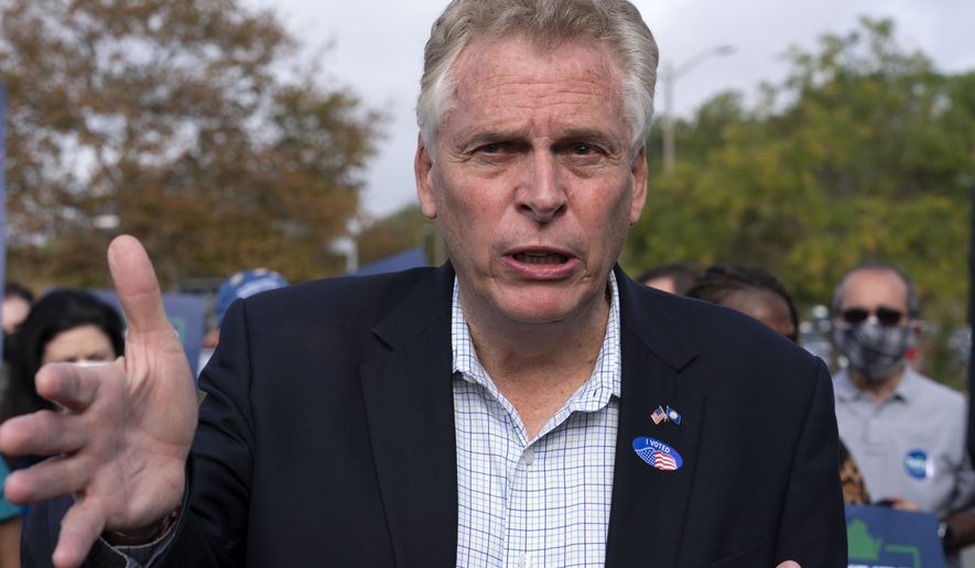 Virginia Democratic gubernatorial candidate and former Gov. Terry McAuliffe, talks to reporters after voting at County Government Center in Fairfax, Va. Wednesday, Oct. 13, 2021. (AP Photo/Jose Luis Magana)
