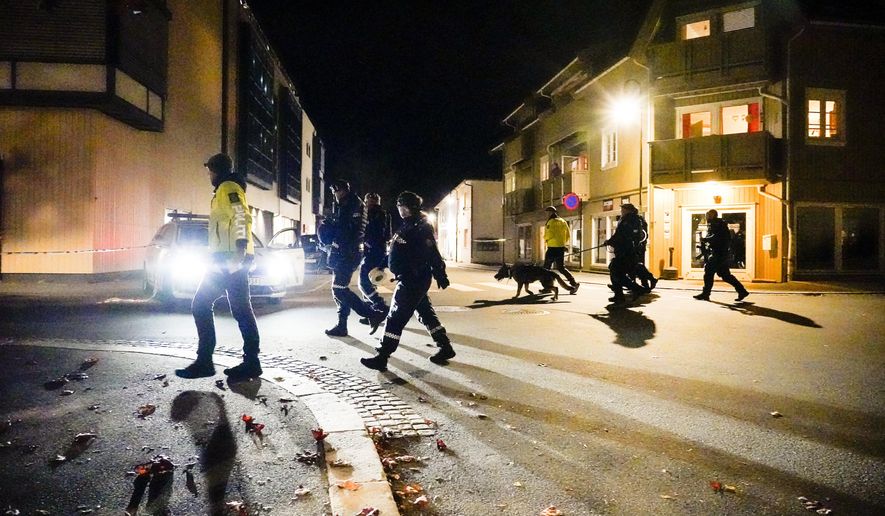 Police walk at the scene after an attack in Kongsberg, Norway, Wednesday, Oct. 13, 2021. Several people have been killed and others injured by a man armed with a bow and arrow in a town west of the Norwegian capital, Oslo. (Hakon Mosvold Larsen/NTB Scanpix via AP)