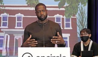 NBA All-Star Dwyane Wade speaks during a news conference Wednesday, Oct. 13, 2021, in Salt Lake City. Apple CEO Tim Cook and Wade joined Utah leaders to announce the completion of a local advocacy group&#39;s campaign to build eight new homes for LGBTQ youth in the U.S. West. (AP Photo/Rick Bowmer)