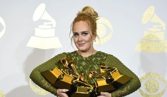 Adele poses in the press room with the awards for album of the year for &amp;quot;25&amp;quot;, song of the year for &amp;quot;Hello&amp;quot;, record of the year for &amp;quot;Hello&amp;quot;, best pop solo performance for &amp;quot;Hello&amp;quot;, and best pop vocal album for &amp;quot;25&amp;quot; at the Grammy Awards in Los Angeles on Feb. 12, 2017. (Photo by Chris Pizzello/Invision/AP, File)