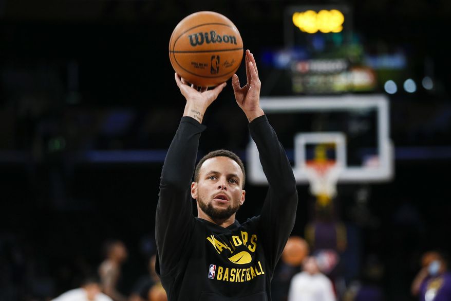 Golden State Warriors guard Stephen Curry warms up before a preseason NBA basketball game against the Los Angeles Lakers in Los Angeles, Tuesday, Oct. 12, 2021. (AP Photo/Ringo H.W. Chiu) **FILE**