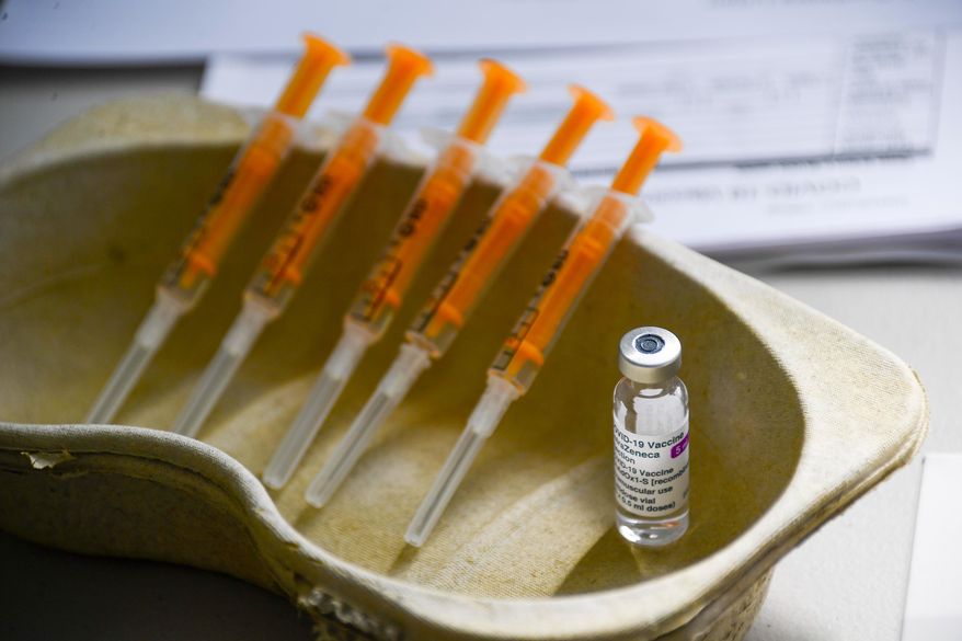 This file photo of vial and syringes shows the AstraZeneca COVID-19 vaccine, on March 22, 2021. Data from a U.S. study on its vaccine shows it is 79% effective. (AP Photo/Alberto Pezzali, File)