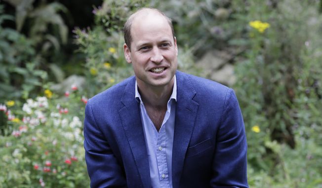 In this Thursday, July 16, 2020, file photo, Britain&#x27;s Prince William speaks with service users during a visit to the Garden House in Peterborough, England. (AP Photo/Kirsty Wigglesworth, File)