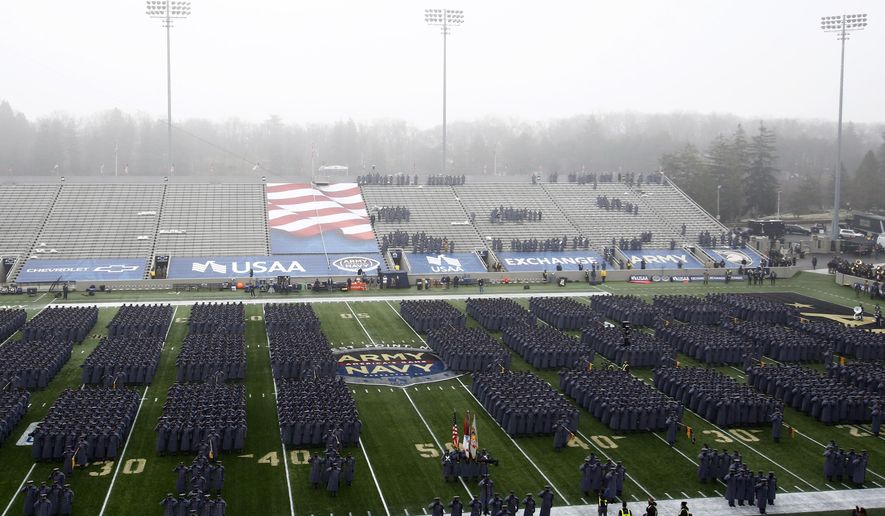 Army cadets march on the field before an NCAA college football game against Navy in West Point, N.Y., in this Saturday, Dec. 12, 2020, file photo. (AP Photo/Adam Hunger, File)