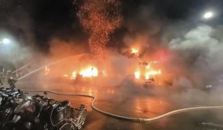 In this image taken from video by Taiwan&#39;s EBC, firefighters battle a blaze at a building in Kaohsiung, in southern Taiwan on Thursday, Oct. 14, 2021. A fire engulfed a 13-story building overnight in southern Taiwan, the island’s semi-official Central News Agency reported Thursday. (EBC via AP )