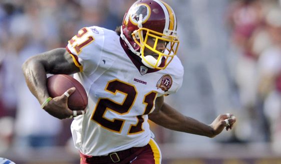 FILE - In this Oct. 7, 2007, file photo, Washington Redskins safety Sean Taylor carries the ball during an NFL football game against the Detroit Lions in Landover, Md. The Washington Football Team plans to retire late safety Sean Taylor&#39;s number before its upcoming game against Kansas City. (AP Photo/Nick Wass, File)
