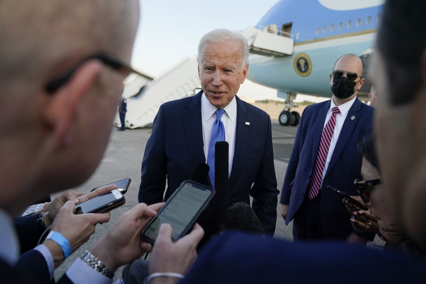 President Joe Biden speaks to members of the media before boarding Air Force One at Bradley International Airport, Friday, Oct. 15, 2021, in Windsor Locks, Conn. (AP Photo/Evan Vucci)