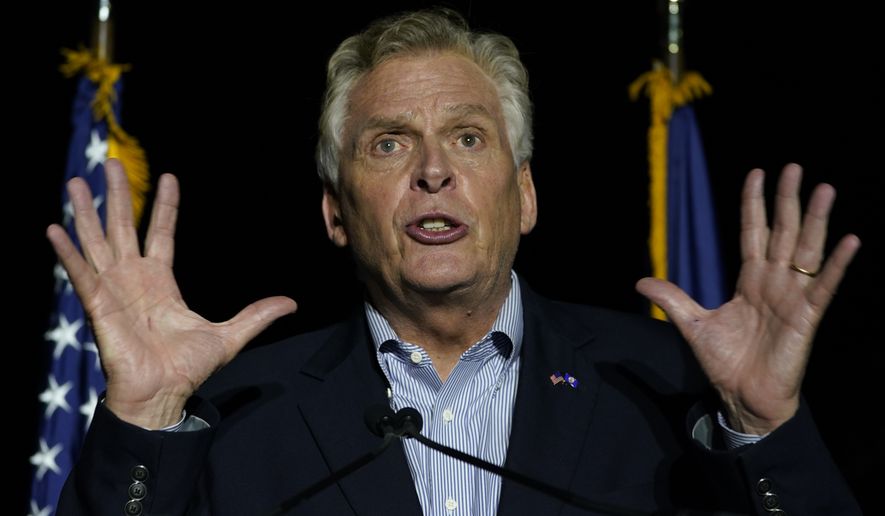 Democratic gubernatorial candidate Terry McAuliffe gestures during a rally in Richmond, Va., Friday, Oct. 15, 2021. McAuliffe will face Republican Glenn Youngkin in the November election. (AP Photo/Steve Helber)