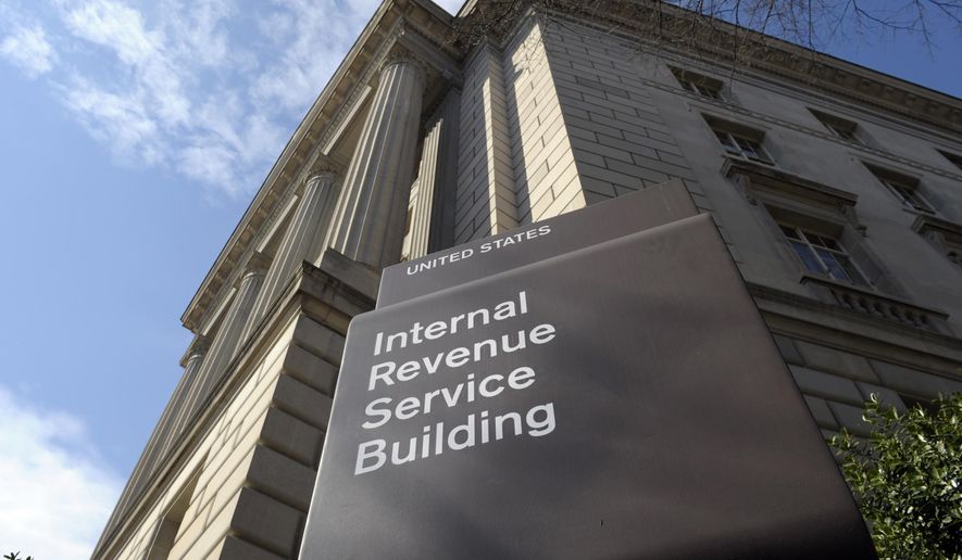 In this March 22, 2013, file photo, the exterior of the Internal Revenue Service (IRS) building is seen in Washington. President Biden’s proposed plan to hire more than 80,000 additional Internal Revenue Service agents could wind up helping the super-wealthy to avoid paying their fair share, according to a new analysis. (AP Photo/Susan Walsh, File)   **FILE**