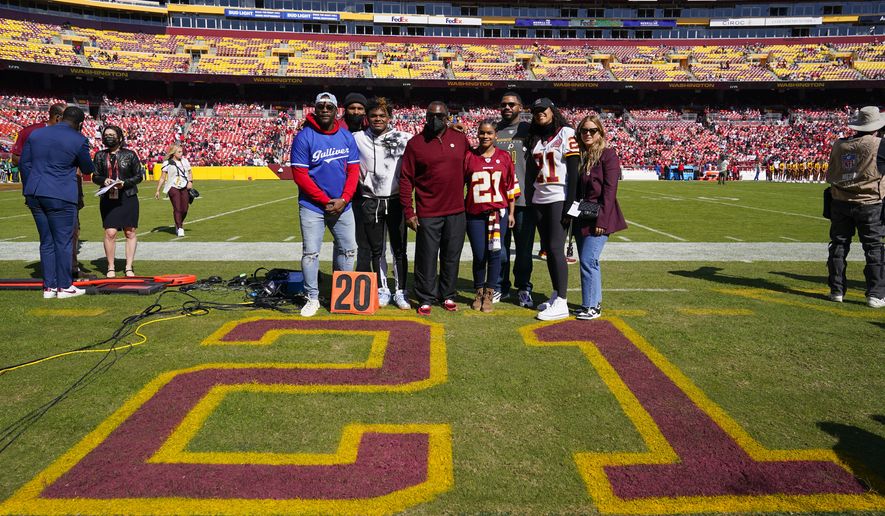 Members of the late Sean Taylor&#x27;s family gather on the field as the Washington Football Team retire his number during a ceremony before the start of an NFL football game against the Kansas City Chiefs, Sunday, Oct. 17, 2021, in Landover, Md. Sean Taylor is only the third player in franchise history to receive such an honor.(AP Photo/Patrick Semansky)