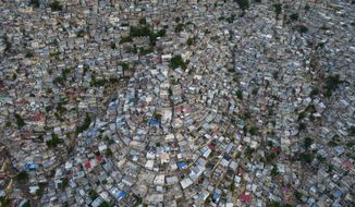 A view of the densely populated Jalousie neighborhood of Port-au-Prince, Tuesday, Sept. 28, 2021. A group of 17 U.S. missionaries including children was kidnapped by a gang in Haiti on Saturday, Oct. 16, 2021 according to a voice message sent to various religious missions by an organization with direct knowledge of the incident. (AP Photo/Rodrigo Abd, file)