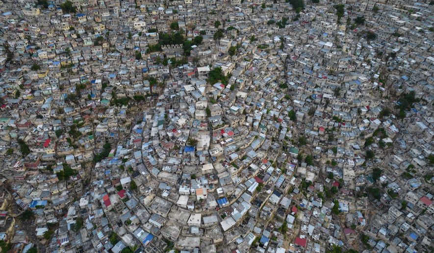 A view of the densely populated Jalousie neighborhood of Port-au-Prince, Tuesday, Sept. 28, 2021. A group of 17 U.S. missionaries including children was kidnapped by a gang in Haiti on Saturday, Oct. 16, 2021 according to a voice message sent to various religious missions by an organization with direct knowledge of the incident. (AP Photo/Rodrigo Abd, file)