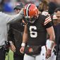 Cleveland Browns head coach Kevin Stefanski, left, touches the helmet of quarterback Baker Mayfield (6) after an injury during the second half of an NFL football game against the Arizona Cardinals, Sunday, Oct. 17, 2021, in Cleveland. (AP Photo/David Richard) **FILE**