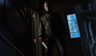 This image released by Universal Pictures shows the character Michael Myers in &amp;quot;Halloween Kills,&amp;quot; directed by David Gordon Green. (Ryan Green/Universal Pictures via AP)