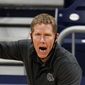 Gonzaga head coach Mark Few calls a play for his team as they play against Oklahoma in the first half of a second-round game in the NCAA men&#39;s college basketball tournament at Hinkle Fieldhouse in Indianapolis, in this Monday, March 22, 2021, file photo. Gonzaga carried a No. 1 ranking all last season before falling a win short of becoming college basketball’s first unbeaten national champion in 45 years. Mark Few’s Bulldogs start this season in the same position, hoping to complete that final step this time around. The Zags were the runaway top choice in The Associated Press Top 25 men’s college basketball preseason poll released Monday, Oct. 18, 2021. (AP Photo/Michael Conroy, File) **FILE**