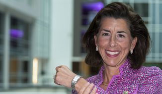 In this Tuesday, Sept. 28, 2021, photo Commerce Secretary Gina Raimondo poses for a photograph with her Bulova watch. Raimondo only wears watches made by Bulova — a company that fired her scientist father, closed its Rhode Island factory and moved production to China in 1983. “It’s been a tribute to my dad,&quot; Raimondo said in an interview, “and a reminder to me that we need to do more to get good manufacturing jobs in America.” (AP Photo/Alex Brandon)