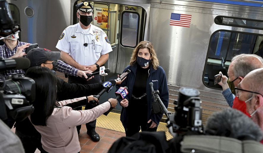 SEPTA General Manager Leslie Richards speaks during a news conference as SEPTA Transit Police Chief Thomas Nestel III stands behind her on an El platform at the 69th Street Transportation Center, Monday, Oct. 18, 2021, in Philadelphia, following a brutal rape on the El, as other riders watched, over the weekend. They discussed the emergency call boxes on SEPTA trains and how to properly contact police from the trains. (Tom Gralish/The Philadelphia Inquirer via AP)