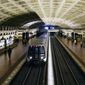 In this April 23, 2021, file photo, a train arrives at Metro Center station in Washington. (AP Photo/Patrick Semansky) ** FILE **