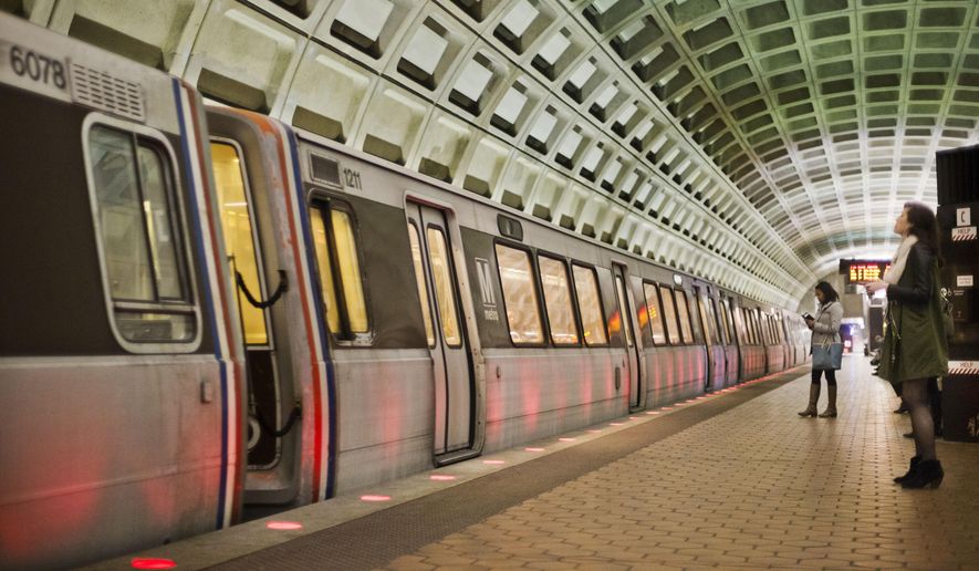 In this March 12, 2015 file photo, passengers wait on the platform before boarding a train at the U Street Metro Station in Washington, part of the public mass transit network for Washington. Washington’s regional Metro system abruptly pulled more than half its fleet of trains from service early Monday morning over a lingering problem with the wheels and axles that caused a dramatic derailing last week. (AP Photo/Pablo Martinez Monsivais)