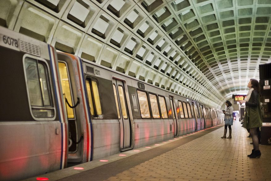 In this March 12, 2015 file photo, passengers wait on the platform before boarding a train at the U Street Metro Station in Washington, part of the public mass transit network for Washington. Washington’s regional Metro system abruptly pulled more than half its fleet of trains from service early Monday morning over a lingering problem with the wheels and axles that caused a dramatic derailing last week. (AP Photo/Pablo Martinez Monsivais)