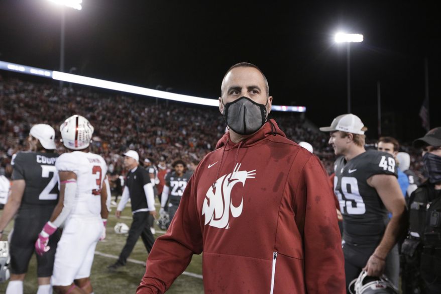 Washington State coach Nick Rolovich walks on the field after the team&#39;s NCAA college football game against Stanford, Saturday, Oct. 16, 2021, in Pullman, Wash. Washington State won 34-31. (AP Photo/Young Kwak) **FILE**
