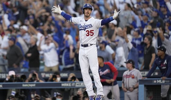 Los Angeles Dodgers center fielder Cody Bellinger reacts after hitting a three-run home run during the eighth inning in Game 3 of baseball&#39;s National League Championship Series against the Atlanta Braves Tuesday, Oct. 19, 2021, in Los Angeles. (AP Photo/Jae Hong)