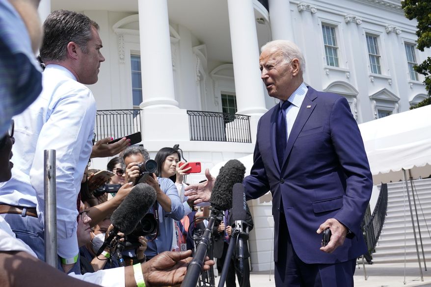 President Joe Biden briefly talks with reporters as he heads to Marine One on the South Lawn of the White House in Washington, Friday, July 16, 2021, to spend the weekend at Camp David. (AP Photo/Susan Walsh)